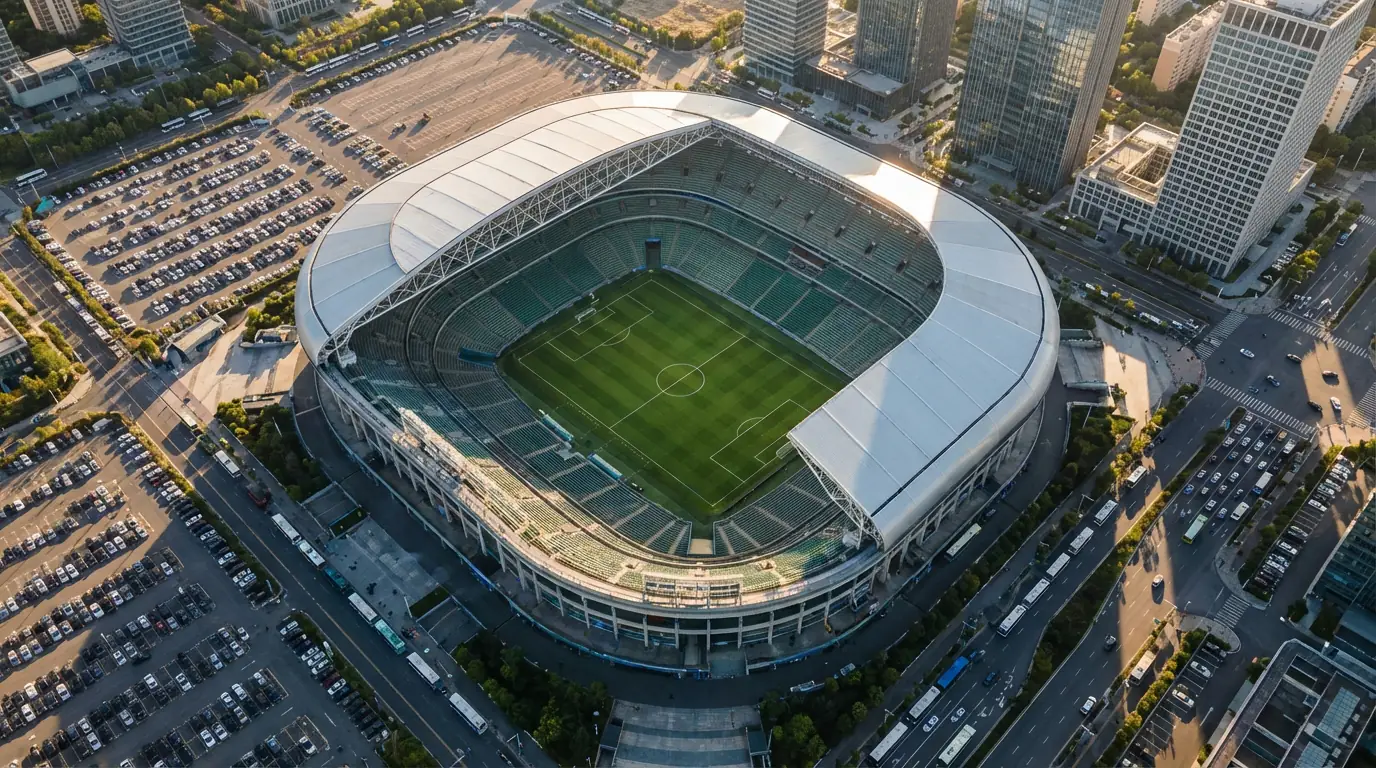 Aerial view of a modern American football stadium prepared for World Cup 2026 matches with a green pitch and filled stands